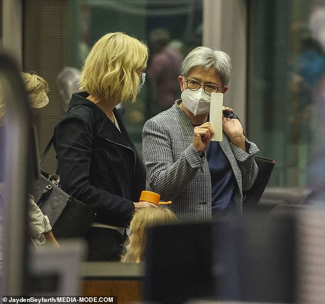 The pair looked engrossed in conversation as they made their way to the departures lounge