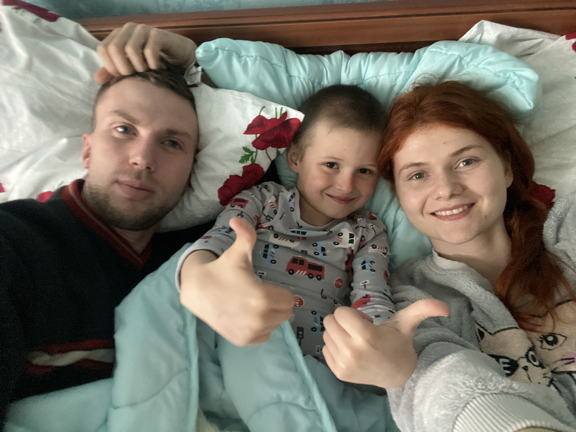 Ilya, center, has found new happiness with Vladimir Bespalov and Maria Bespalaya after losing both parents in the first week of the war.