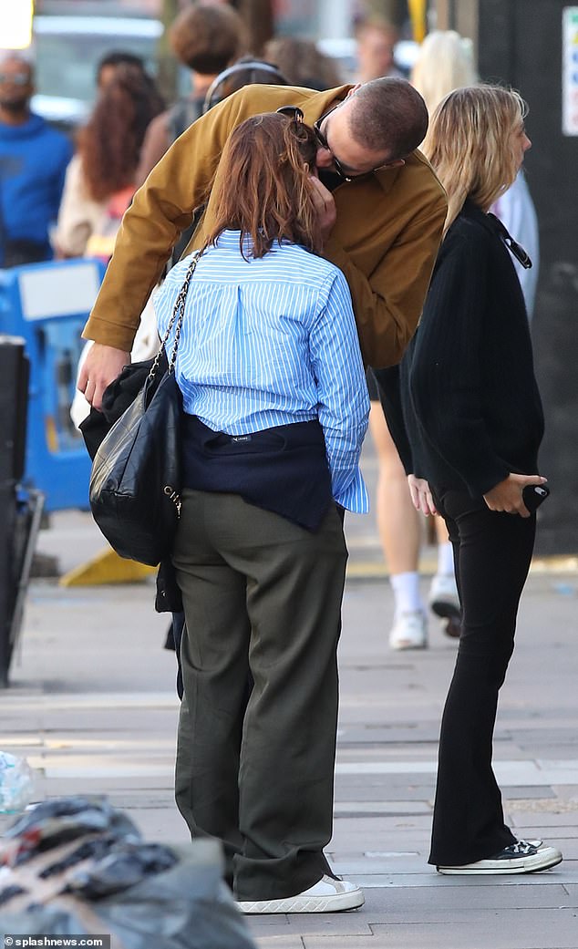 Packing on the PDA: During their latest outing, the pair were seen looking very cosy while strolling through north London