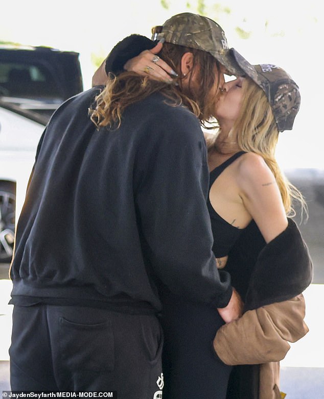 Imogen and her beau, whose name has not been revealed, gazed lovingly into each other's eyes before sharing a passionate kiss in the car park