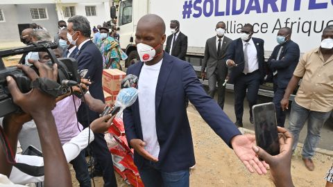 Drogba speaks to media during a food and protection material distribution Abidjan in 2020.