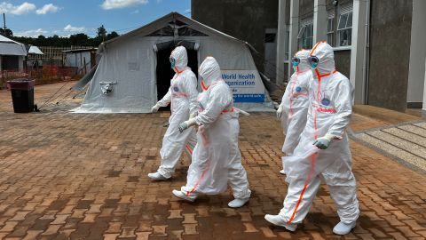 Health workers don extensive Personal Protective Equipment (PPE) to enter the red zones where patients are receiving treatment