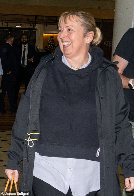 Casual: She cut a casual figure in a black hoodie and black leggings with matching trainers