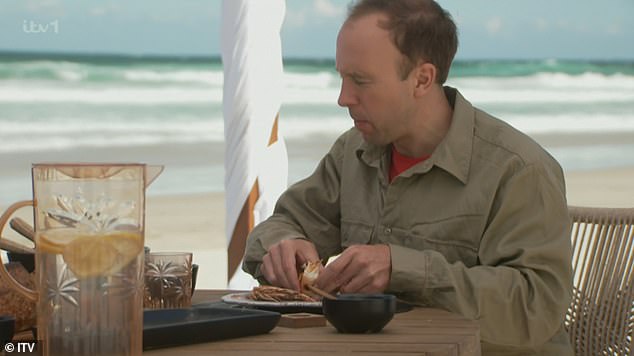 Tucking in: While their campmates were green with jealousy, Matt, Sue and Jill tucked into a tasty barbecue on the beach