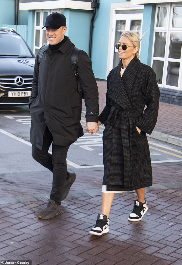 Loved-up: Kai Widdrington and Nadiya Bychkova looked smitten as they left the hotel hand-in-hand