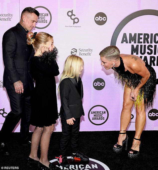 Talking to her kids: In a particularly touching moment, Pink leaned down to speak with her children while on the red carpet