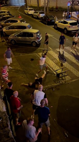 Several of the men can be seen sporting England and Wales football shirts, while another clutches one of the iconic Wales bucket hats