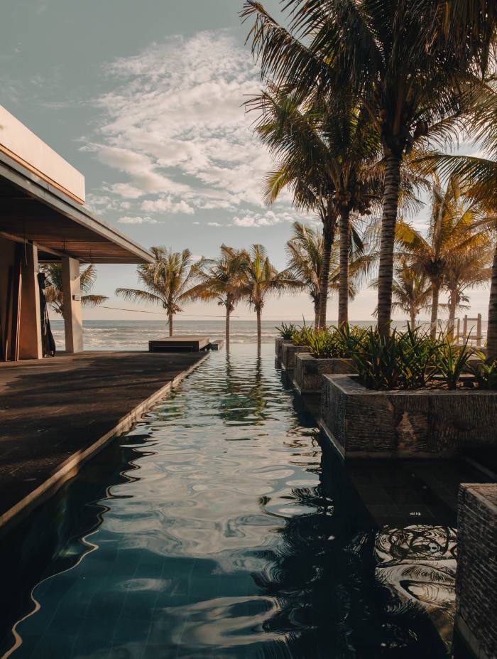 A pool with beach view at Hotelito by Musa