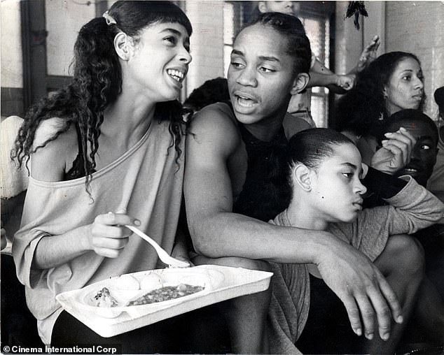 Cara (left), as Coco enjoying a meal on-set beside co-star Gene Ray, who played Leroy