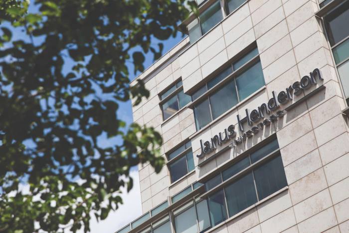 A logo sign outside of a facility occupied by the Janus Henderson Group