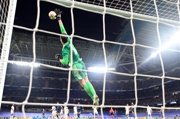 Real Madrid’s Belgian goalkeeper Thibaut Courtois makes a save