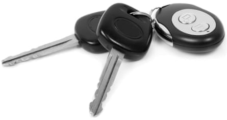 Close-up of car keys over white background