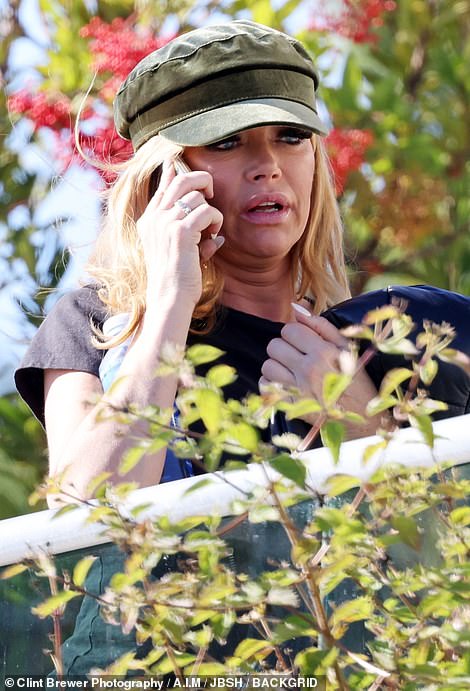 Denise Richards looks shaken and tearful after her car was SHOT in terrifying road rage incident