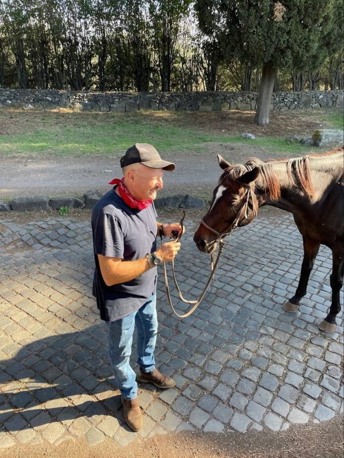 Guide Sandro Bernardini prepares the horses for a four-hour personalised tour