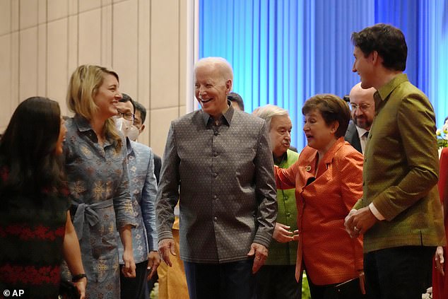 Joe Biden dons a traditional Cambodian shirt to dine on wild Mekong lobster