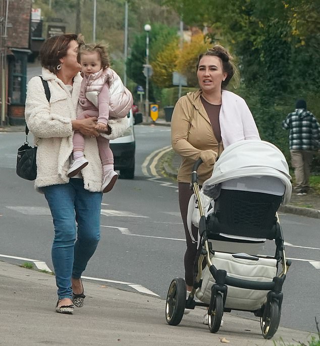 Lauren Goodger puts her figure on display in skin-tight brown leggings