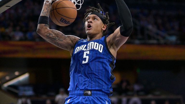 Orlando Magic forward Paolo Banchero (5) dunks during the second half of an NBA basketball game against the Golden State Warriors, Thursday, Nov. 3, 2022, in Orlando, Fla. (AP Photo/Phelan M. Ebenhack)