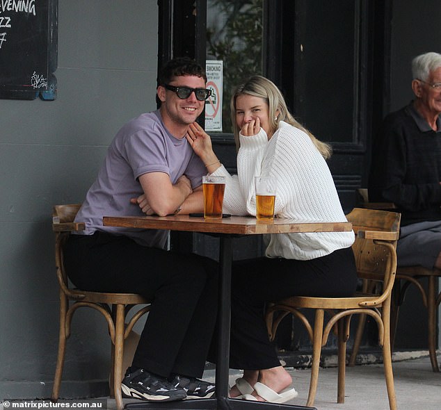 Olivia Frazer and her new boyfriend pack on the PDA as they enjoy lunch in Sydney