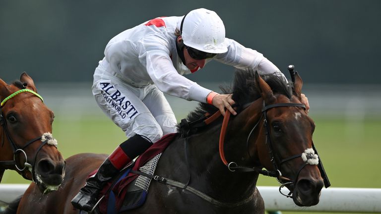 Zambezi Magic, ridden by Adam Kirby (right), wins on the Flat at Haydock Park