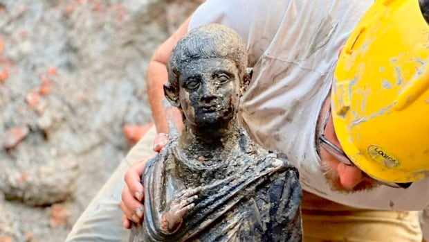 ‘Exceptional’ find of ancient bronze statues uncovered in Tuscany