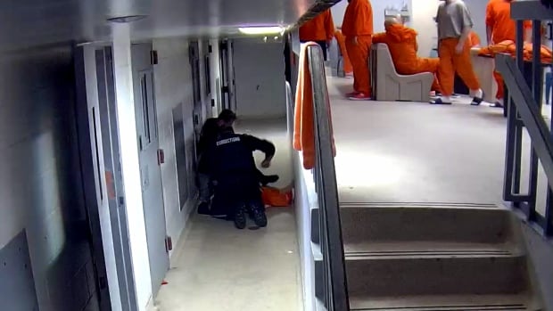 Videos showing jail guards punching inmate played in court after failed bid to hide them