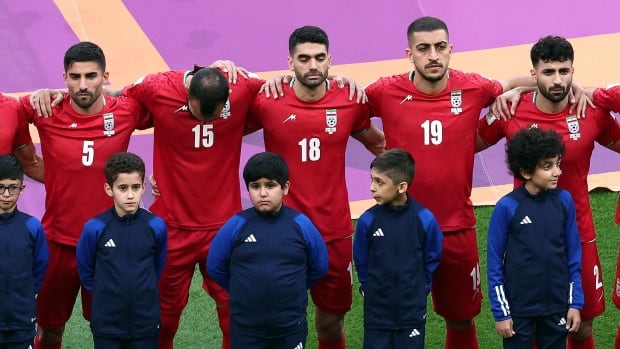 Iran’s soccer team silent during national anthem in Qatar in support of protesters back home