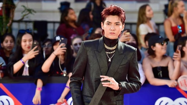 Chinese-Canadian pop star Kris Wu sentenced to 13 years in China on rape, group sex charges