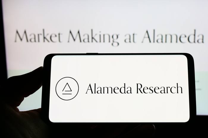 Alameda Research logo on a phone and computer screen