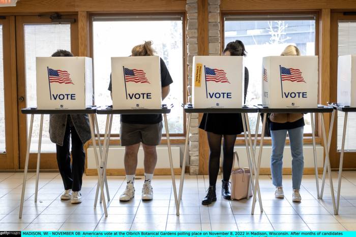 Four people voting at a US polling station