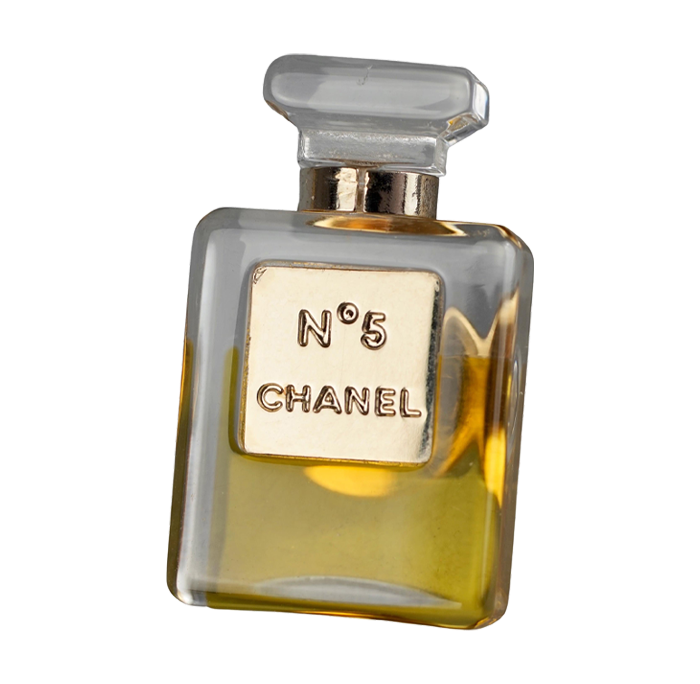 a brooch in the shape of a Chanel perfume bottle