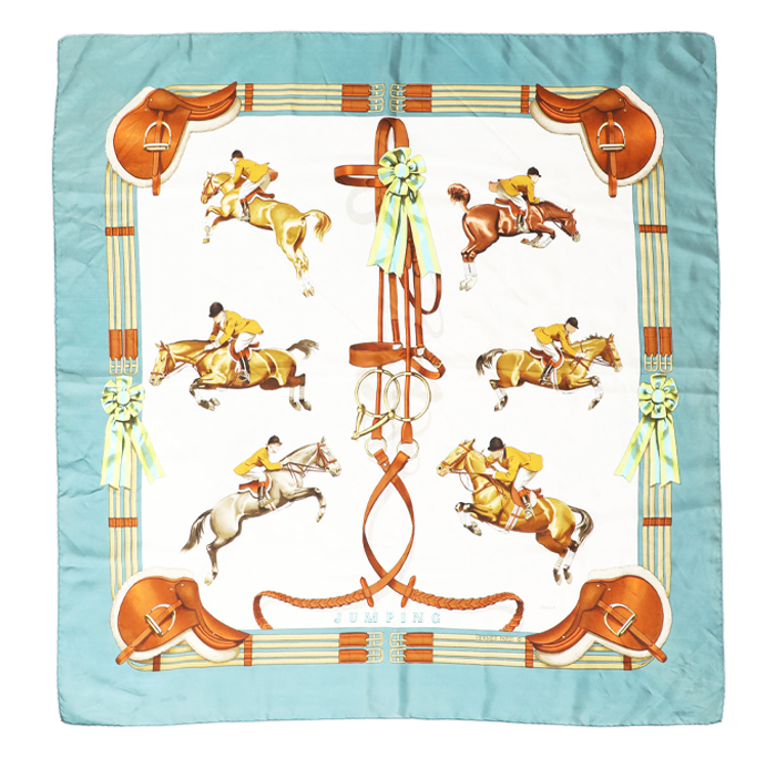 A scarf decorated with images of horses and riders 