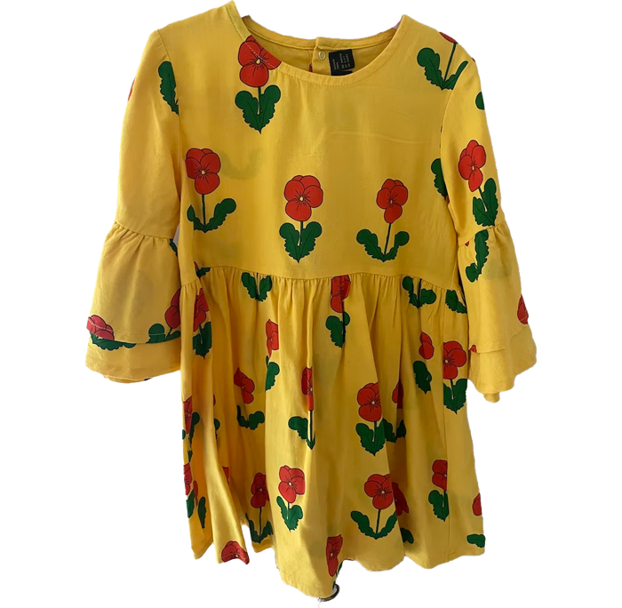 A yellow girl’s dress with red flowers