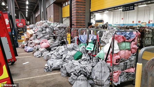 Piles of undelivered post have been pictured stacking up at depots across the country as Royal Mail strikes threaten to cause havoc over Christmas