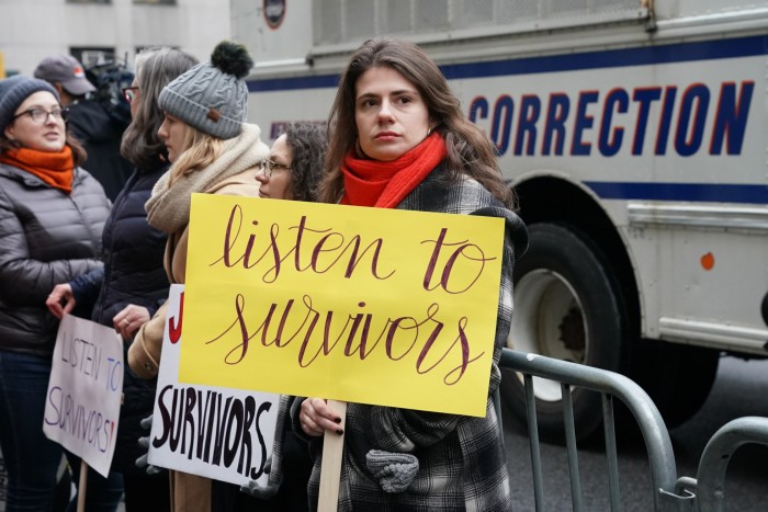 Survivors of sexual abuse gather outside the courthouse before the arrival of Harvey Weinstein at the State Supreme Court in Manhattan