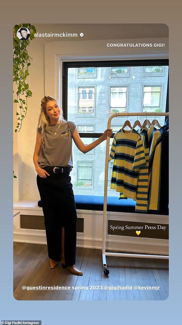 Throwing on a t-shirt: Hadid wore a gray t-shirt with tiny sleeves and the same long black skirt she wore the pop-up on Friday