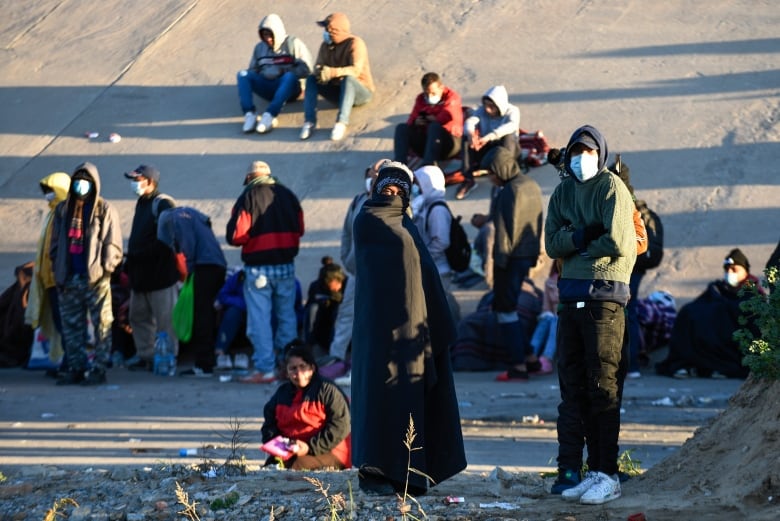 Migrants walk slowly toward the U.S. border in Ciudad Juarez, Mexico.