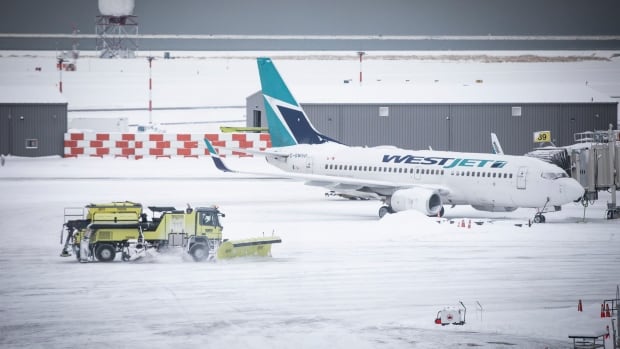 Chaos continues for travellers trying to fly from B.C. after heavy, pre-Christmas snowfall