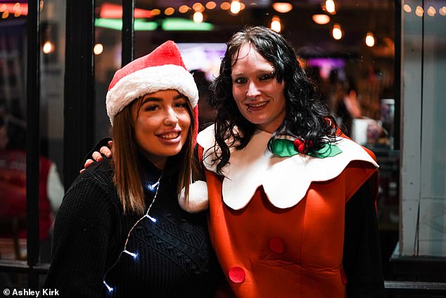 Partygoers get into the festive spirit as they dress up in Christmas outfits for a night out in Nottingham