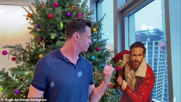 Standing in front of the Christmas tree at his swanky penthouse in New York's Chelsea district on Saturday, the actor trolled the Hollywood hunk