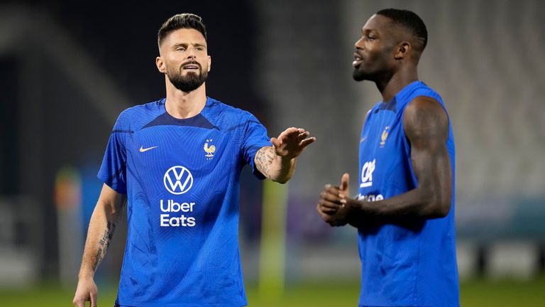 France&#39;s Olivier Giroud, left, speaks with Marcus Thuram