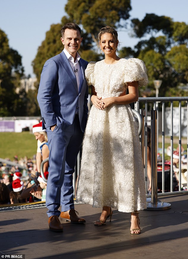 Her co-host David Campbell (left)  looked schmick in a blue suit and white button-up shirt