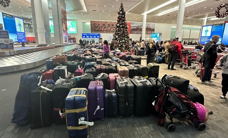 Dozens and dozens of luggages can be seen at an airport.