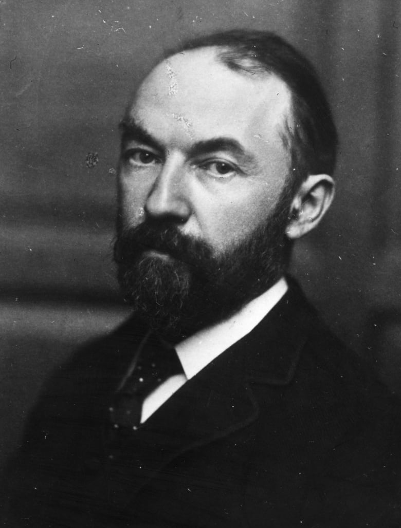 Thomas Hardy English poet and novelist poses for a photo in black and white