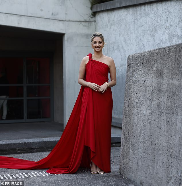 Brooke Boney dazzles in red as she and David Campbell co-host Carols by Candlelight