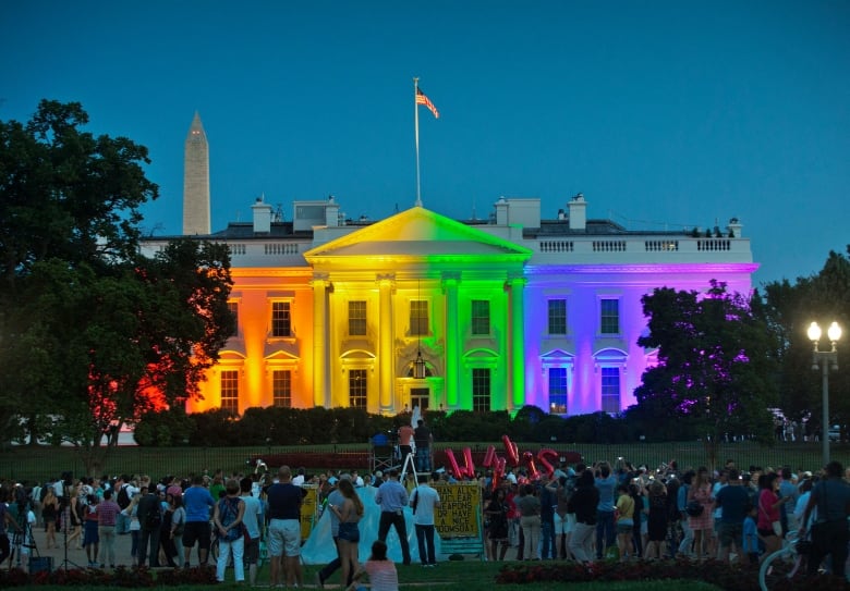 The White House is illumintaed with the colours of the rainbow.