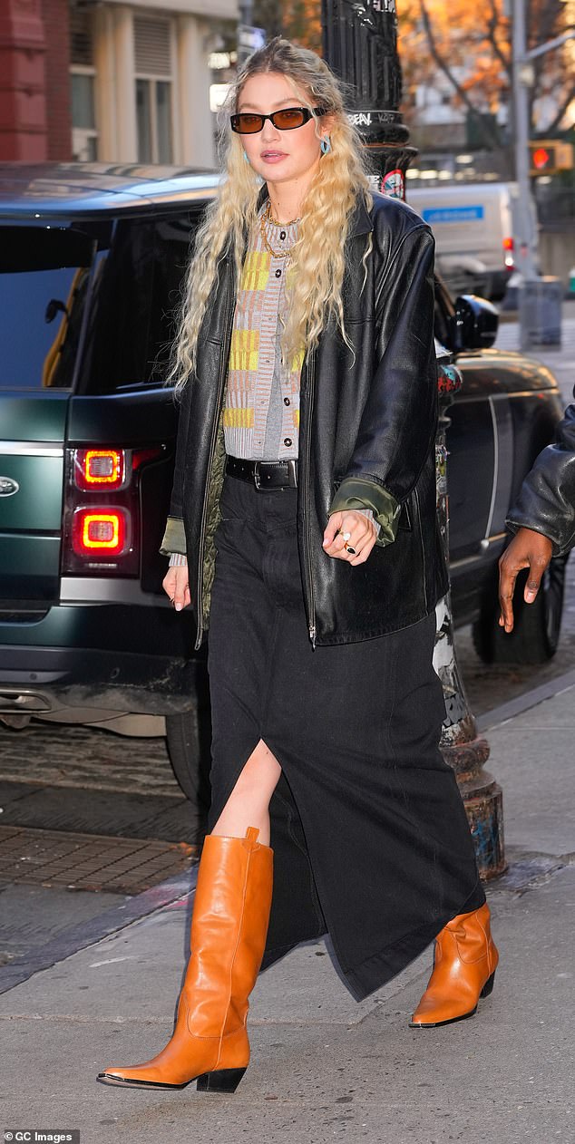 Gigi Hadid looks casual chic in black leather jacket and long black skirt in NYC