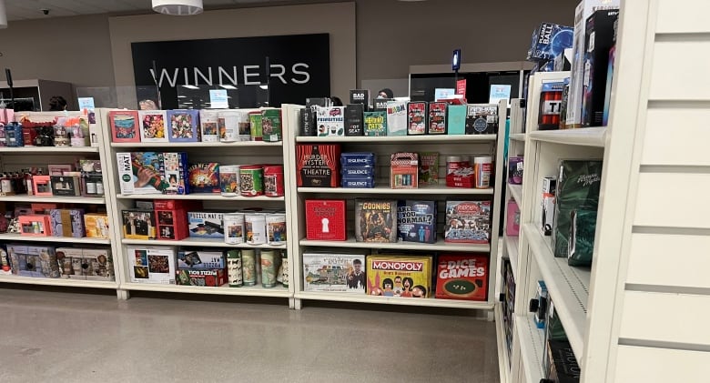 Shelves of boxed products at a Winners store.