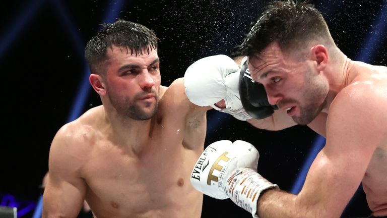 GLASGOW, SCOTLAND - FEBRUARY 26: Jack Catterall (L) and Josh Taylor (R) exchange punches during their undisputed super lightweight championship fight at The OVO Hydro on February 26, 2022 in Glasgow, Scotland. (Photo by Mikey Williams/Top Rank Inc via Getty Images)