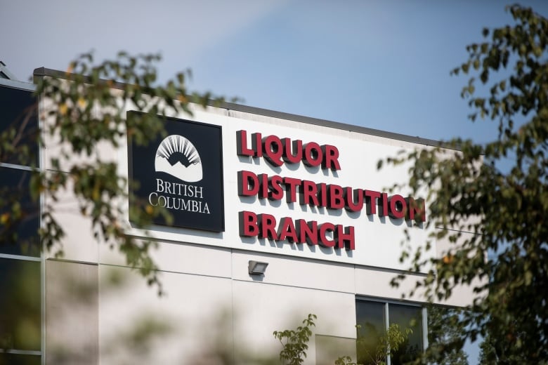 A sign outside a building that reads 'British Columbia Liquor Distribution Branch'.