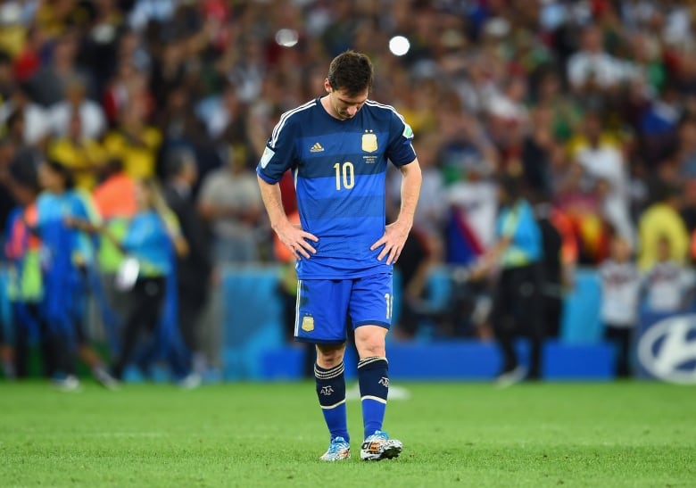 A player is alone on a soccer field.